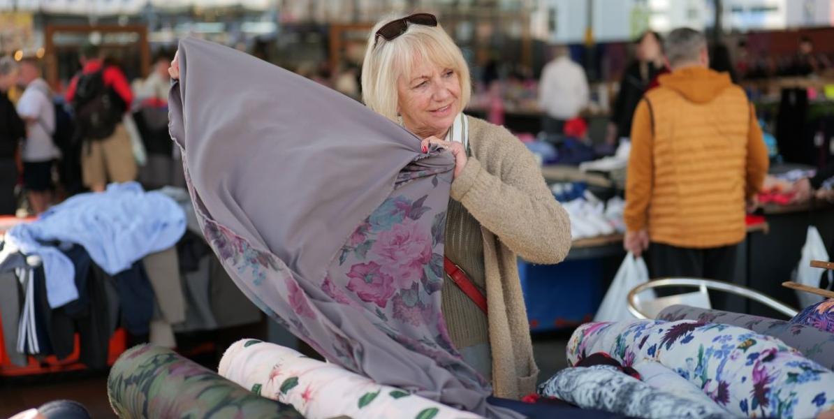 Textile trader holding fabric