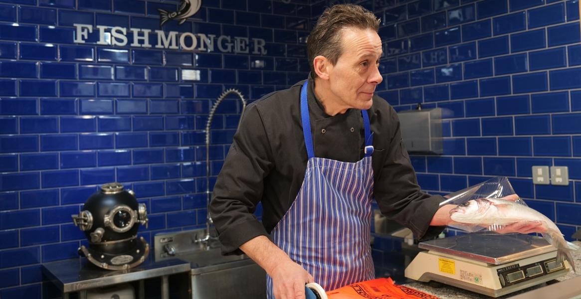 Trader serving fish