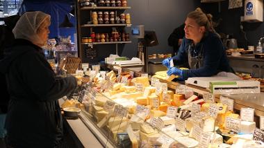 Cheese selection behind counter.