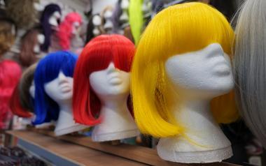 Row of colourful wigs