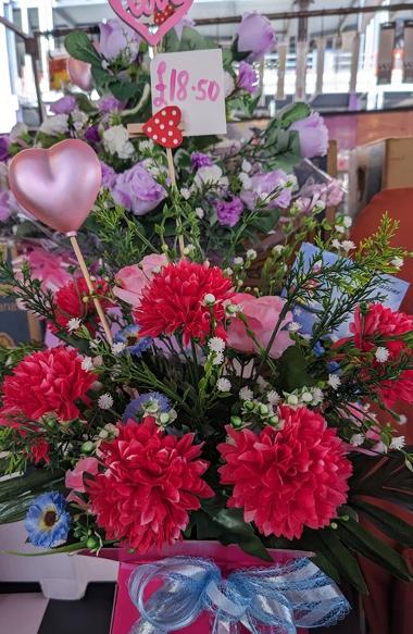 Purple and pink rose bouquets with  heart decorations