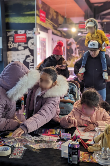 Children colouring on craft table