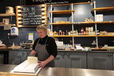 Trader slicing cheese