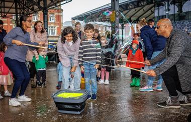 Performers making bubbles