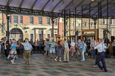 People dancing under the canopy