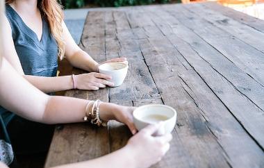 Friend having coffee close up