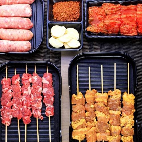 Assortment of BBQ food on skewers