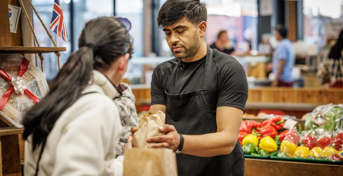 Super Veg trader serving customer