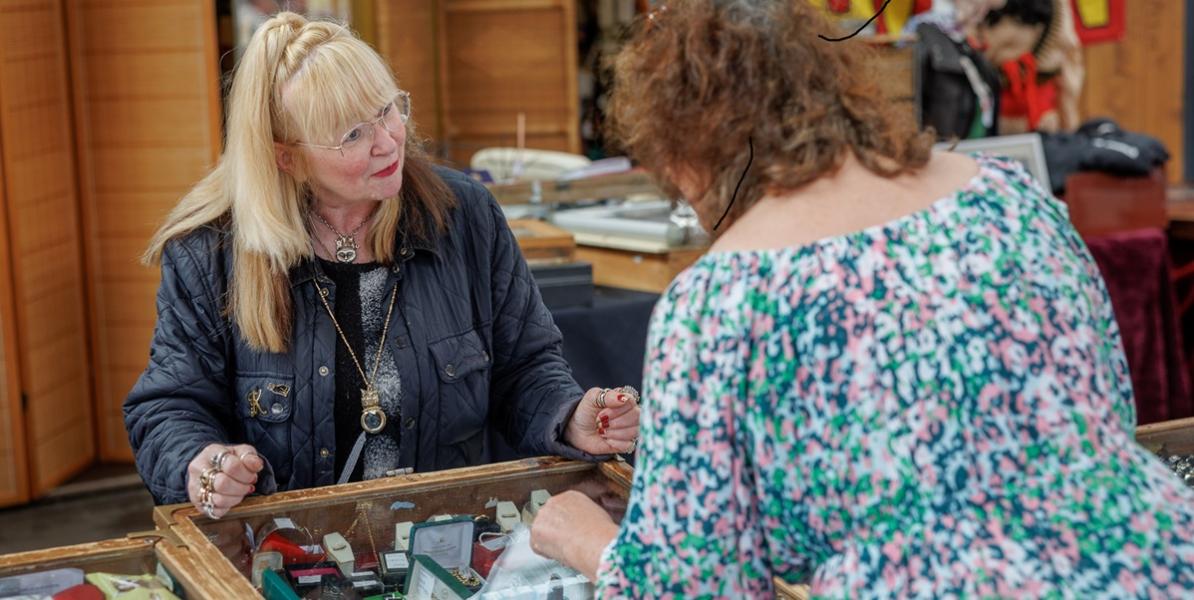 Karen's Collectables trader serving customer