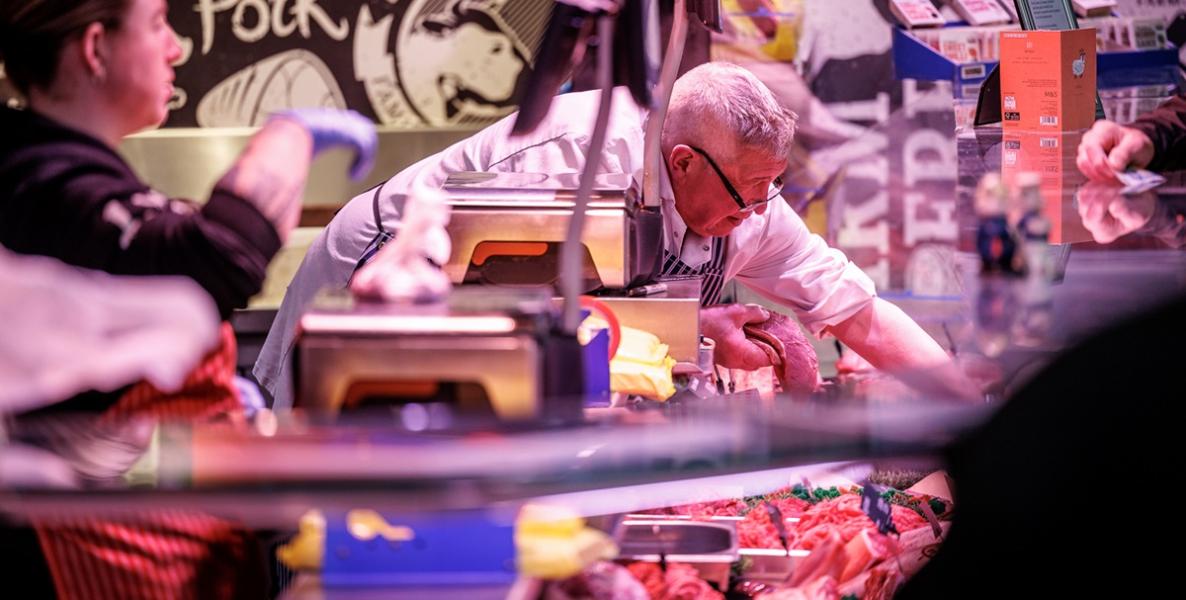 Livesey's Butcher trader serving customer